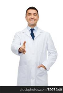 healthcare, profession, greeting, people and medicine concept - smiling male doctor in white coat giving hand for handshake