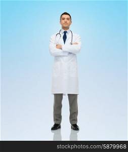 healthcare, profession, people and medicine concept - male doctor in white coat stethoscope over blue background