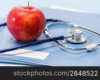 Healthcare red apple and medical stethoscope healthy lifestyle