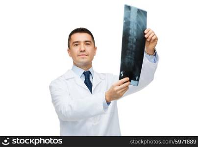 healthcare, rontgen, people and medicine concept - male doctor in white coat holding x-ray