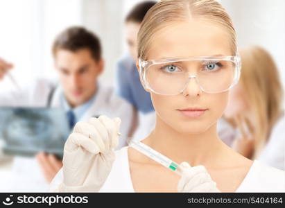 healthcare, science, medicine and laboratory concept - female scientist in eyeglasses holding thermometer