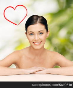 healthcare, spa and beauty concept - face and hands of beautiful woman