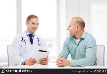healthcare, technology and medicine concept - smiling doctor with tablet pc computer and patient in hospital