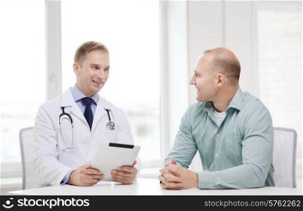 healthcare, technology and medicine concept - smiling doctor with tablet pc computer and patient in hospital