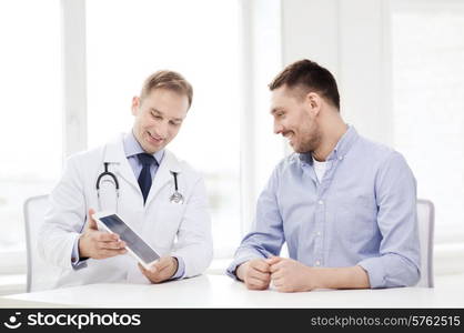 healthcare, technology and medicine concept - smiling doctor with tablet pc computer and patient in hospital