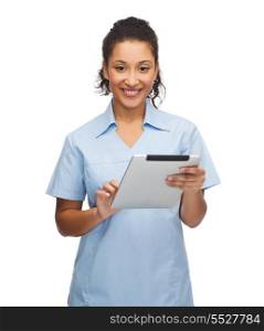 healthcare, technology and medicine concept - smiling female african american doctor or nurse with tablet pc computer