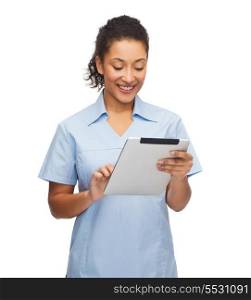healthcare, technology and medicine concept - smiling female african american doctor or nurse with tablet pc computer