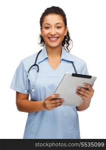 healthcare, technology and medicine concept - smiling female african american doctor or nurse with stethoscope and tablet pc computer