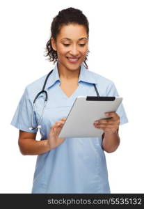 healthcare, technology and medicine concept - smiling female african american doctor or nurse with stethoscope and tablet pc computer