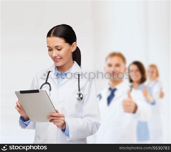 healthcare, technology and medicine concept - smiling female doctor with stethoscope and tablet pc computer