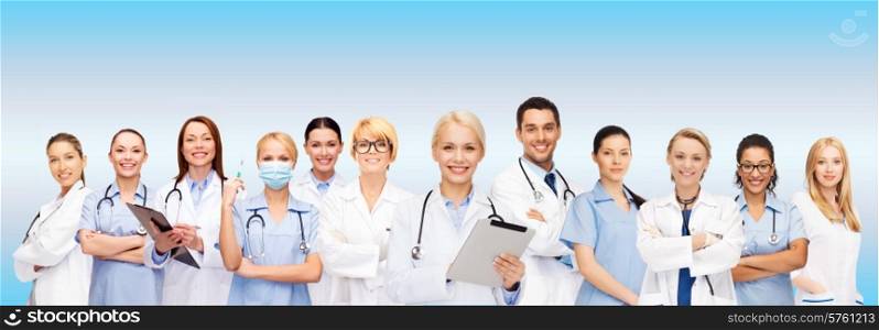 healthcare, technology and medicine concept - smiling female doctors and nurses with tablet pc computer