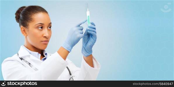 healthcare, vaccination, anesthesia and medical concept - african american female doctor holding syringe with injection over blue background