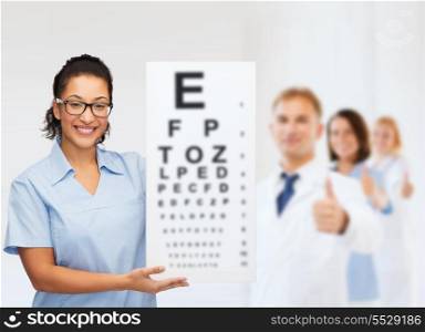 healthcare, vision and medicine concept - smiling female african american doctor or nurse in eyeglasses with small white blank board