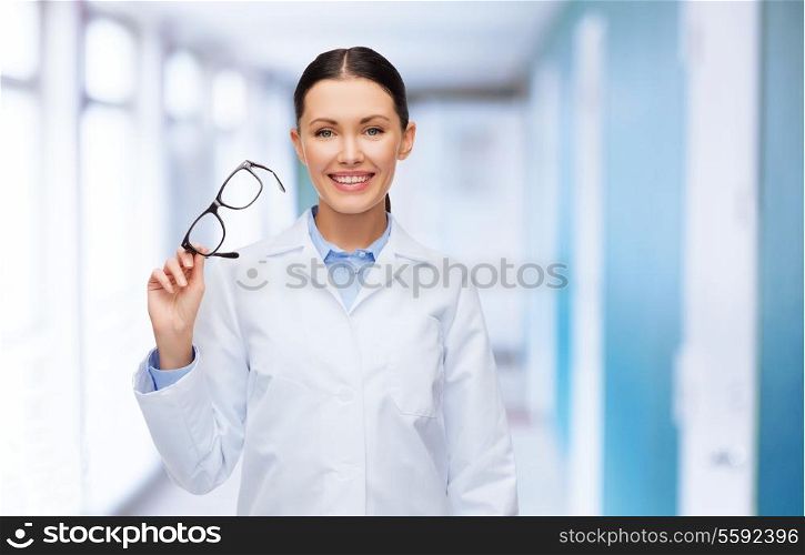 healthcare, vision and medicine concept - smiling female doctor without stethoscope