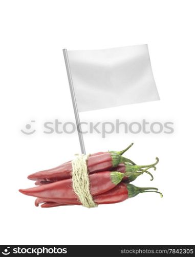 Healthy and organic food concept. Fresh red hot chili pepper with flag showing the benefits or the price of fruits.. Healthy and organic food concept