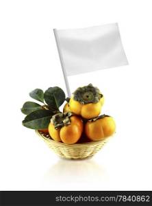 Healthy and organic food concept. Healthy and organic food concept. Fresh persimmon with flag showing the benefits or the price of fruits.