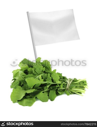 Healthy and organic food concept. Healthy and organic food concept. Fresh Green Rocket or Roquette leaves with flag showing the benefits or the price of fruits.
