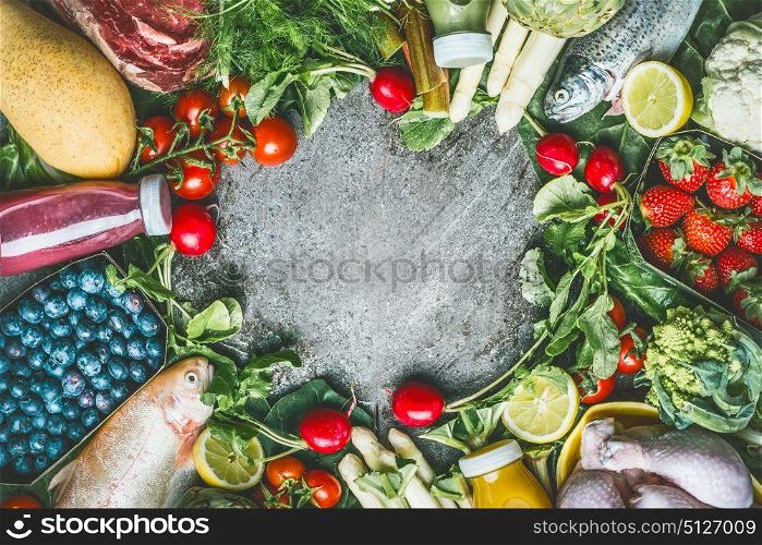Healthy balanced eating and beverages concept. Various organic foods and drinks ingredients: fish,meat,poultry,chicken,vegetables , fruits and berries on gray stone background, top view, frame