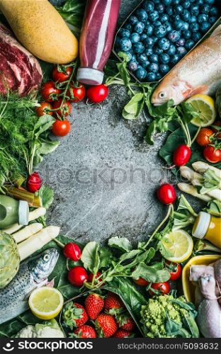 Healthy balanced food ingredients for tasty clean cooking and eating: vegetables, fruits,berries, meat,chicken and fish on vintage background, top view, frame, vertical