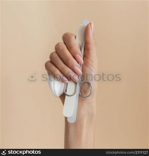 healthy beautiful manicure person holding accessories