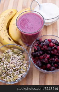 healthy berries juice smootie on wooden board