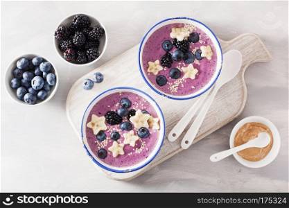 healthy berry smoothie bowl with banana and sesame seed