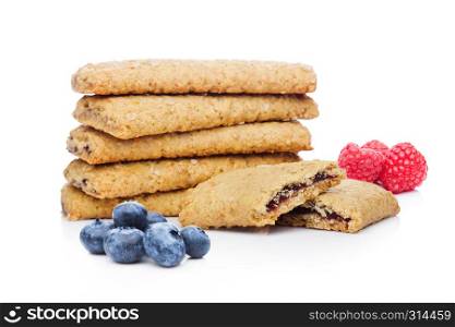 Healthy bio breakfast biscuits with blueberries and raspberries on white background