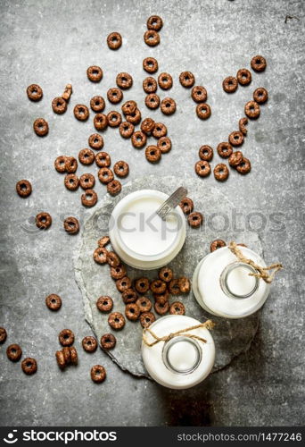 Healthy Breakfast. Chocolate cereal with milk. On the stone table.. Healthy Breakfast. Chocolate cereal with milk.