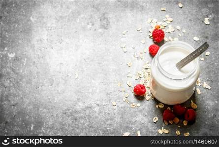 Healthy Breakfast . Milk cream with cereal and berries . On the stone table.. Healthy Breakfast . Milk cream with cereal and berries .