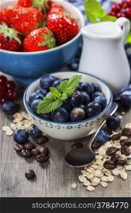 Healthy breakfast - muesli and berries - health and diet concept