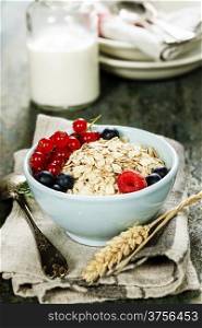 Healthy Breakfast.Oat flake, berries and fresh milk. Health and diet concept