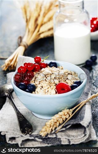Healthy Breakfast.Oat flake, berries and fresh milk. Health and diet concept