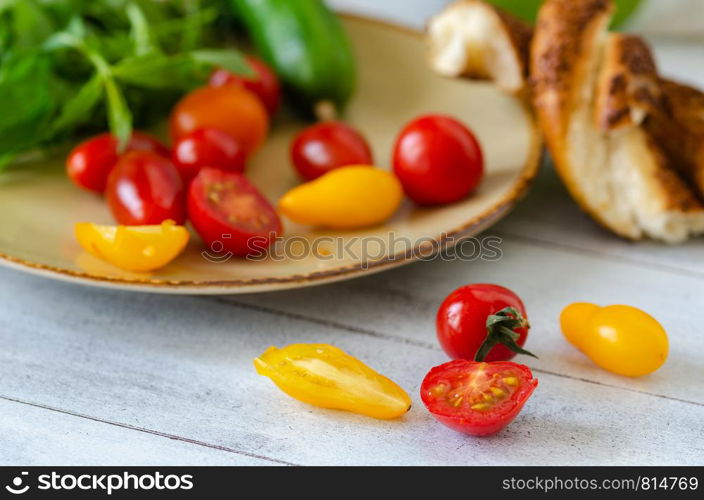 Healthy breakfast, tomato,mint,cucumber and turkish bagel are on the table.