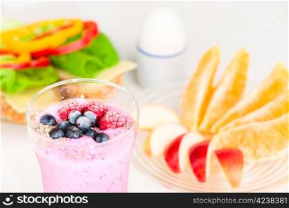 Healthy breakfast, white background and focus on berries.