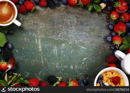 Healthy Breakfast with coffee, corn flakes, milk and berry on old wooden background. Health and diet concept