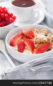 healthy breakfast with granola and strawberry