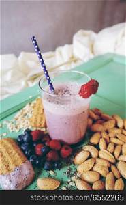 Healthy breakfast with smoothie, fruits and grains