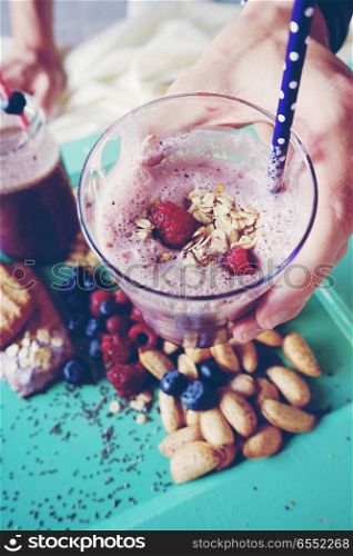 Healthy breakfast with smoothie, fruits and grains