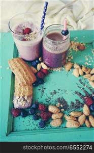 Healthy breakfast with smoothies, fruits and grains