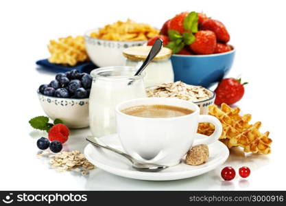 Healthy breakfast - yogurt, coffee, muesli and berries - Health and Diet concept
