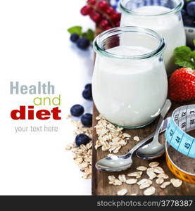 Healthy breakfast - yogurt, muesli, berries and measurement tape - health and diet concept