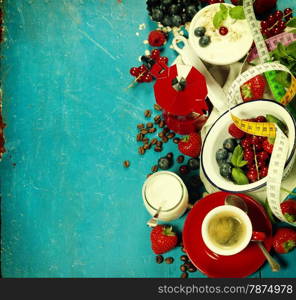 Healthy breakfast - yogurt with muesli and berries - health and diet concept. Blue background