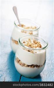 Healthy breakfast - yogurt with muesli - health and diet concept