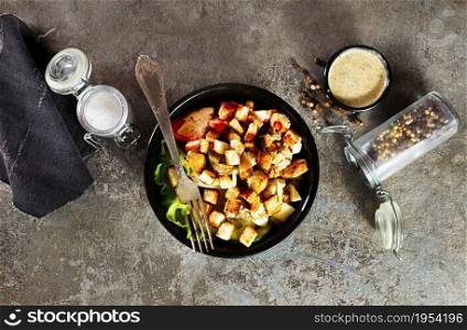 Healthy chicken salad with vegetables and croutons