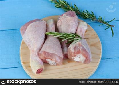 Healthy chicken thighs on a blue background