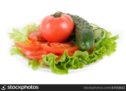 Healthy combination of lettuce, tomato and cucumber on white