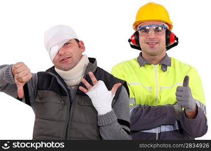 Healthy construction worker standing next to an injured man