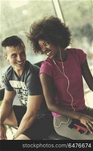 healthy couple have break at crossfit gym african american woman with afro hairstyle. couple in a gym have break