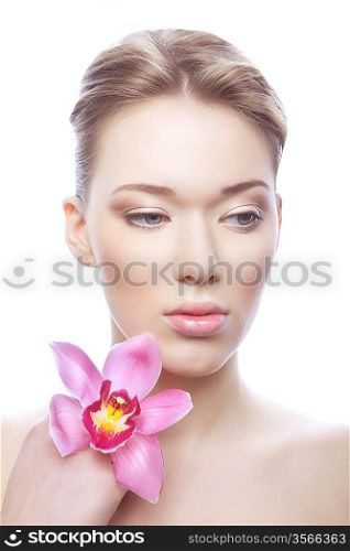 healthy cute woman with clean skin and flower on white background