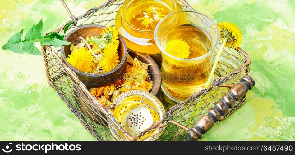 Healthy dandelion honey and tea. Honey from a blooming spring dandelion and cup of tea